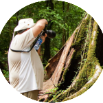 Close up image of a boy clicking photograph